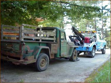 The Willys leaving it's home in the trees and going to it's new home with us.